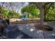 Shaded playground with slides and equipment, featuring a park bench for relaxing nearby at 15416 W Valentine St, Surprise, AZ 85379