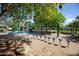 Playground with slides, climbing structures, and a bridge set on a sand surface for endless fun at 15416 W Valentine St, Surprise, AZ 85379