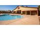 Community pool with deck and restroom/shower area at 15416 W Valentine St, Surprise, AZ 85379