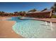 Beautiful pool with multiple water features and comfortable lounge seating area at 15416 W Valentine St, Surprise, AZ 85379