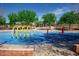 Colorful splash pad featuring playful water features on a bright blue surface at 15416 W Valentine St, Surprise, AZ 85379
