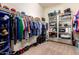 Spacious walk-in closet features ample storage with shelving and hanging space for organized living at 15416 W Valentine St, Surprise, AZ 85379