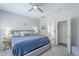 Primary bedroom with view into ensuite bathroom at 15848 W Calavar Rd, Surprise, AZ 85379