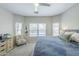 Bright bedroom with large window view of outdoor pool and patio at 15848 W Calavar Rd, Surprise, AZ 85379