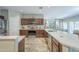 Large kitchen with an island, granite countertops, stainless steel appliances, and an open layout at 15848 W Calavar Rd, Surprise, AZ 85379