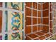 Detail shot of decorative tile in bathroom niche featuring floral pattern on the tile at 1618 W Vernon Ave, Phoenix, AZ 85007