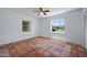 Bedroom with ceiling fan, tile floors and large windows at 1618 W Vernon Ave, Phoenix, AZ 85007