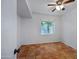 Bedroom featuring a ceiling fan, tile flooring, and a window with outside views at 1618 W Vernon Ave, Phoenix, AZ 85007