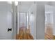 Hallway with wood flooring leading to additional rooms at 1618 W Vernon Ave, Phoenix, AZ 85007