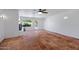 Spacious living room with brick fireplace, ceiling fan, and tile floors at 1618 W Vernon Ave, Phoenix, AZ 85007
