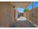A covered patio with an adjacent stucco wall offers views of the backyard at 1618 W Vernon Ave, Phoenix, AZ 85007
