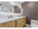 Bathroom with illuminated mirror, double sinks, chic vanity, and sleek fixtures at 1624 E Campbell Ave # 51, Phoenix, AZ 85016