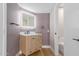 Modern bathroom with wood vanity, illuminated mirror and stylish fixtures at 1624 E Campbell Ave # 51, Phoenix, AZ 85016