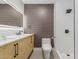 Renovated bathroom features herringbone vanity, LED mirror, new toilet, and tiled shower at 1624 E Campbell Ave # 51, Phoenix, AZ 85016