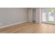 Bright bedroom with natural light, wood floors and closet with curtains at 1624 E Campbell Ave # 51, Phoenix, AZ 85016