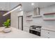 Bright modern kitchen with stainless appliances, light counters and eat in island at 1624 E Campbell Ave # 51, Phoenix, AZ 85016