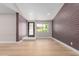 Bright and open living room featuring hardwood floors and large windows at 1624 E Campbell Ave # 51, Phoenix, AZ 85016
