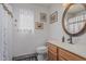 Cozy bathroom featuring classic fixtures, a sink, and framed artwork at 16654 N 19Th Pl, Phoenix, AZ 85022