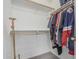 Walk-in closet with hanging rods and shelves for optimal organization and storage space at 16654 N 19Th Pl, Phoenix, AZ 85022