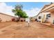 Expansive backyard showcasing block fence, mature tree, storage shed, and a blank canvas for your dream outdoor space at 17128 N Princess Pl, Surprise, AZ 85374