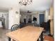 Open dining room with wood-look tile flooring that flows into an inviting living space at 17128 N Princess Pl, Surprise, AZ 85374