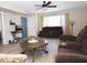 Cozy living room featuring comfortable seating, a ceiling fan, and plenty of natural light at 17128 N Princess Pl, Surprise, AZ 85374