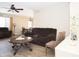 Inviting living room with neutral tones, comfortable seating, and an adjacent dining area at 17128 N Princess Pl, Surprise, AZ 85374