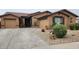 Charming single-story home features a desert landscape, a two-car garage, and a welcoming front entrance at 18177 W Tasha Dr, Surprise, AZ 85388