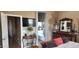 View of TV, hallway, table and bathroom from the main bedroom at 18177 W Tasha Dr, Surprise, AZ 85388