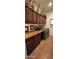 A functional laundry room features wooden cabinets, countertop decor, and modern LG appliances on tiled flooring at 18177 W Tasha Dr, Surprise, AZ 85388
