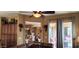 The living room has neutral walls, access to the outside patio, and a ceiling fan at 18177 W Tasha Dr, Surprise, AZ 85388