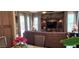 Comfortable living space with a large sectional sofa, custom built-ins, and bright, natural lighting at 18177 W Tasha Dr, Surprise, AZ 85388