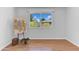 Bright bedroom showcasing a large window with neighborhood views and artwork at 19018 N Concho Cir, Sun City, AZ 85373