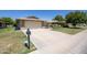 Charming single-story home with a two-car garage and well-maintained front yard at 19018 N Concho Cir, Sun City, AZ 85373