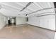 Spacious garage with ample storage cabinets, offering organized parking and utility space at 19018 N Concho Cir, Sun City, AZ 85373