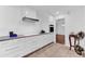 Bright kitchen with white cabinets, stainless steel appliances, and tiled floors at 19018 N Concho Cir, Sun City, AZ 85373
