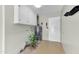 Functional laundry room featuring storage cabinets, water heater, and access door at 19018 N Concho Cir, Sun City, AZ 85373
