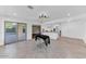 Well-lit living space with tile flooring, seamlessly connecting the kitchen and patio at 19018 N Concho Cir, Sun City, AZ 85373