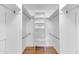 Spacious walk-in closet featuring adjustable shelving for customizable storage solutions at 19018 N Concho Cir, Sun City, AZ 85373