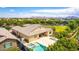 Stunning home with a backyard featuring a pool, spa, outdoor kitchen, and ample green space, ideal for entertaining at 20256 E Canary Ct, Queen Creek, AZ 85142