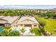 Desirable home showcasing a pool, spa, patio, and verdant landscaping, creating a private backyard oasis at 20256 E Canary Ct, Queen Creek, AZ 85142