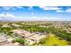 Beautiful aerial of a Gathering neighborhood, displaying mature landscaping and numerous private backyard pools at 20256 E Canary Ct, Queen Creek, AZ 85142