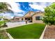 Expansive backyard with lush turf, a built-in grill and outdoor seating at 20256 E Canary Ct, Queen Creek, AZ 85142