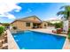 Spacious backyard with pool, patio, built-in grill and outdoor seating at 20256 E Canary Ct, Queen Creek, AZ 85142
