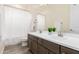 Bright bathroom featuring a double vanity, a large mirror, and stylish fixtures at 20256 E Canary Ct, Queen Creek, AZ 85142