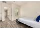 Bright bedroom with a bed and modern decor with view of other building through window at 20256 E Canary Ct, Queen Creek, AZ 85142