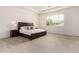Spacious bedroom with plush carpet, large window, and neutral decor at 20256 E Canary Ct, Queen Creek, AZ 85142