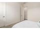 View of a bright carpeted bedroom featuring doors and a window with natural light at 20256 E Canary Ct, Queen Creek, AZ 85142