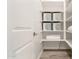 Walk-in closet featuring built-in shelving and ample storage space at 20256 E Canary Ct, Queen Creek, AZ 85142