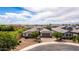 Well-maintained home featuring a paver driveway, mature trees, and inviting curb appeal in a desirable neighborhood at 20256 E Canary Ct, Queen Creek, AZ 85142